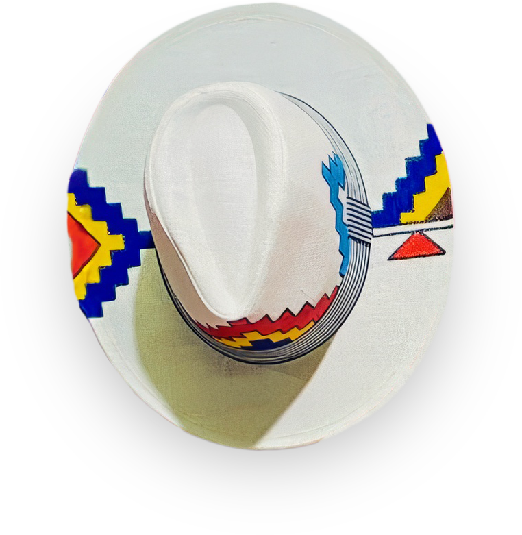 A white hat with a wide brim features bold, colourful geometric patterns in red, blue, yellow, and black, resembling traditional indigenous or folk art. The hat is photographed from above on a black background.
