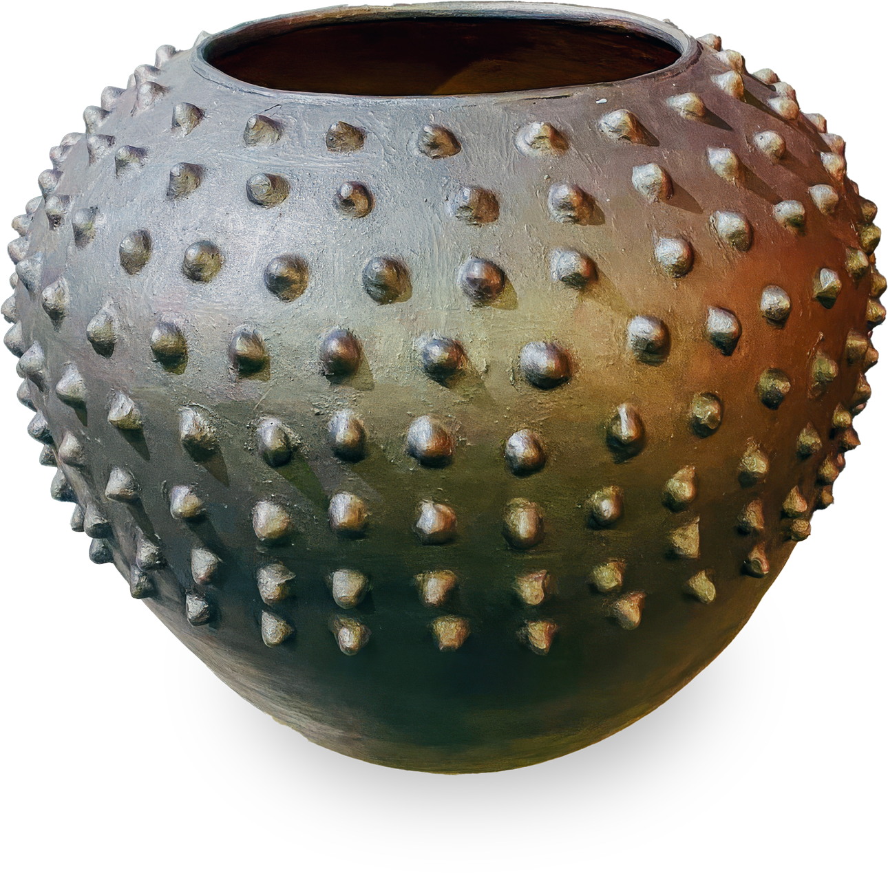 A large, round clay pot with a wide opening and covered in evenly spaced, rounded spikes. The pot has an earthy, textured surface with a gradient of brown and green tones, giving it a rustic and artistic appearance.