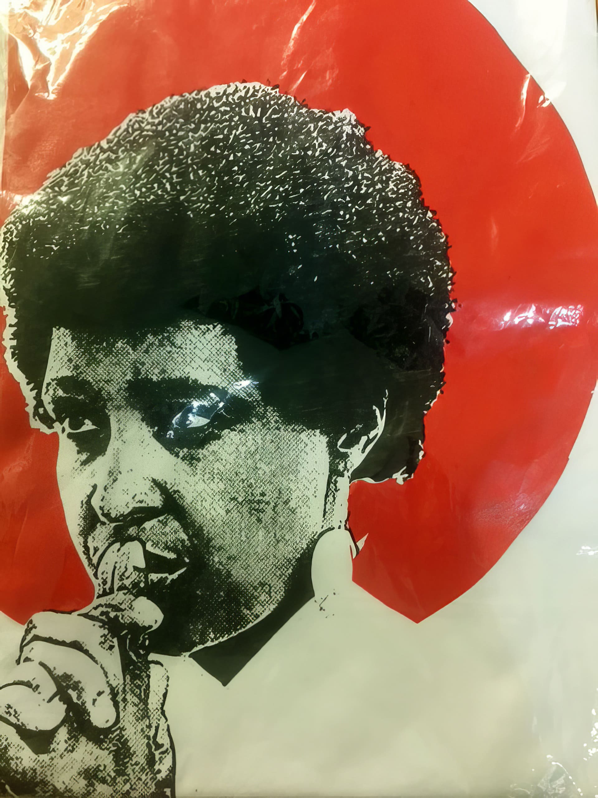 A black-and-white illustration of a thoughtful person with short curly hair and a finger touching their lips, set against a bold red circle background. The person's expression is contemplative and serious.