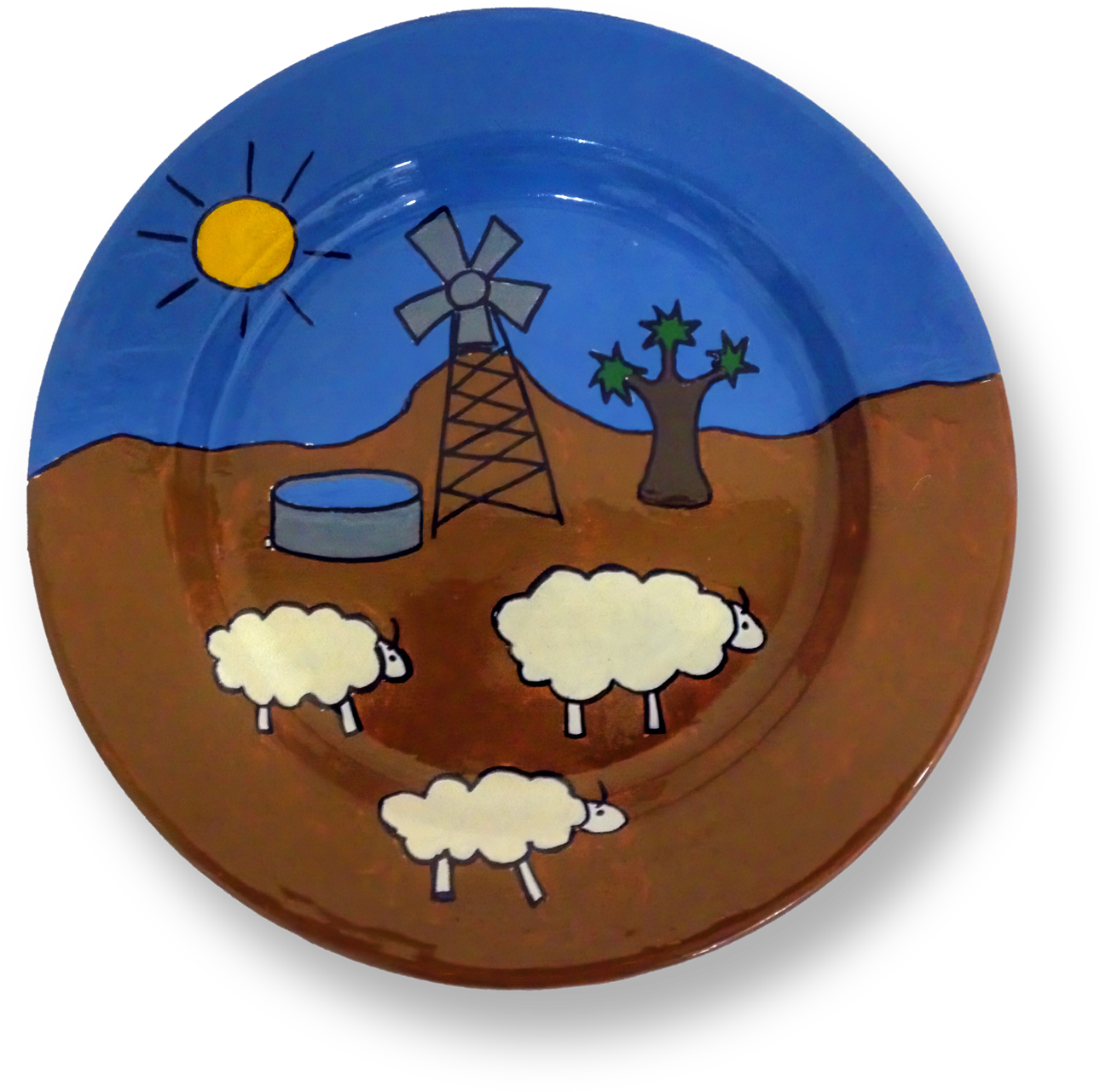 A plate features a desert scene with three cartoon sheep, a lone tree, a blue water tank, a windmill, and a yellow sun with rays, all set against a blue sky and brown ground. The design is simple and playful, using bold lines and solid colours.