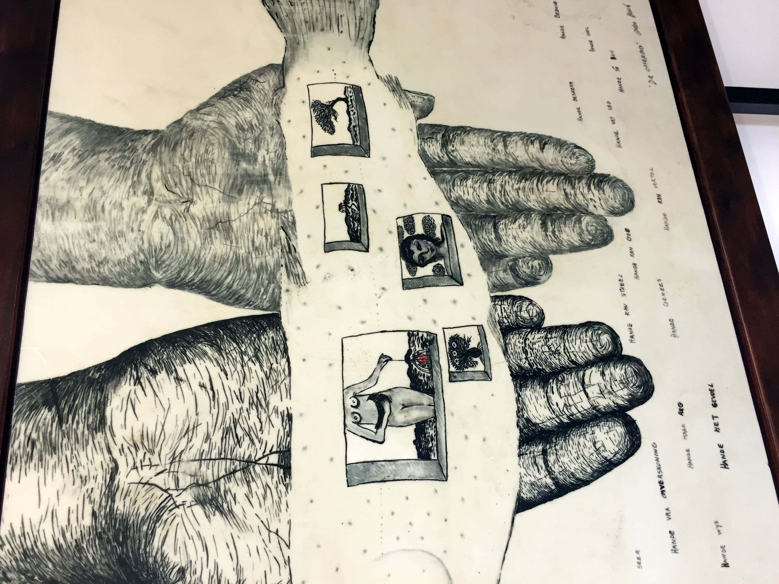 A black and white drawing of two large, open hands facing up. On the palms are four small, framed illustrations, each depicting abstract or surreal imagery. Faint, scattered text appears around the hands on the background.