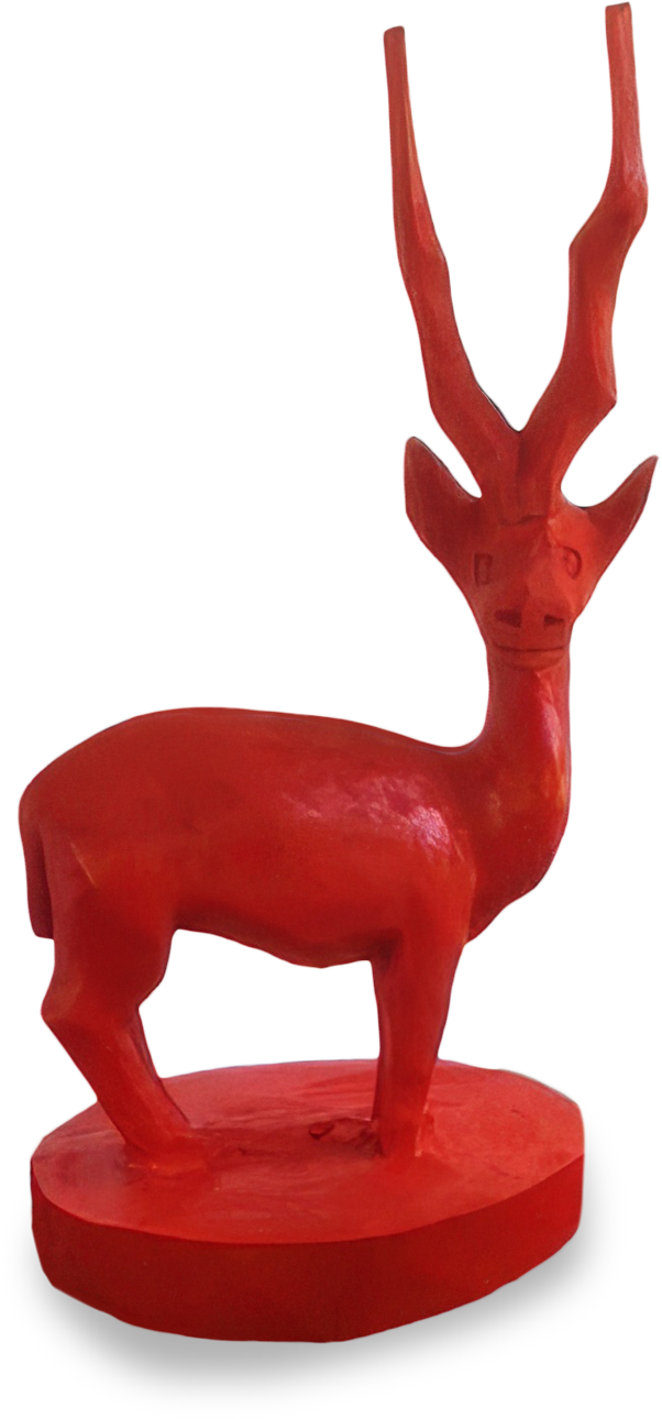 A bright red sculpture of an antelope or gazelle stands on an oval base. The animal has long, curved horns and a simplified, stylised body with minimal detail, and its head is turned slightly to one side.