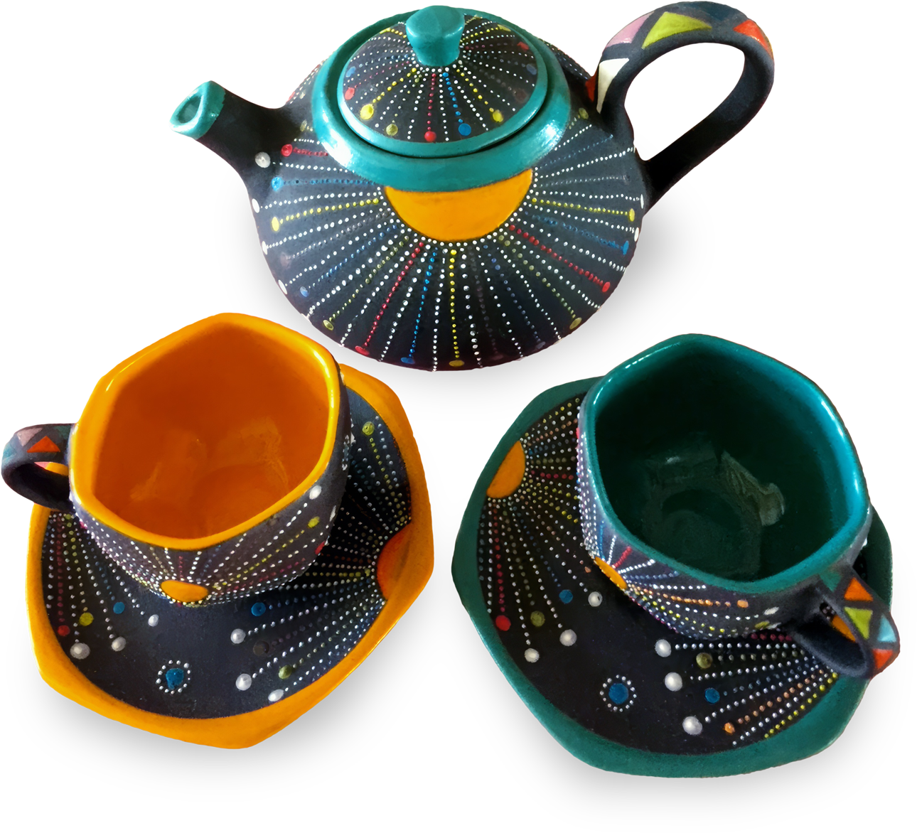 A colourful ceramic tea set with a teapot, two cups, and matching saucers. The set features black backgrounds decorated with dotted patterns in white, yellow, red, blue, and green, radiating like fireworks. The cup interiors are teal and orange.