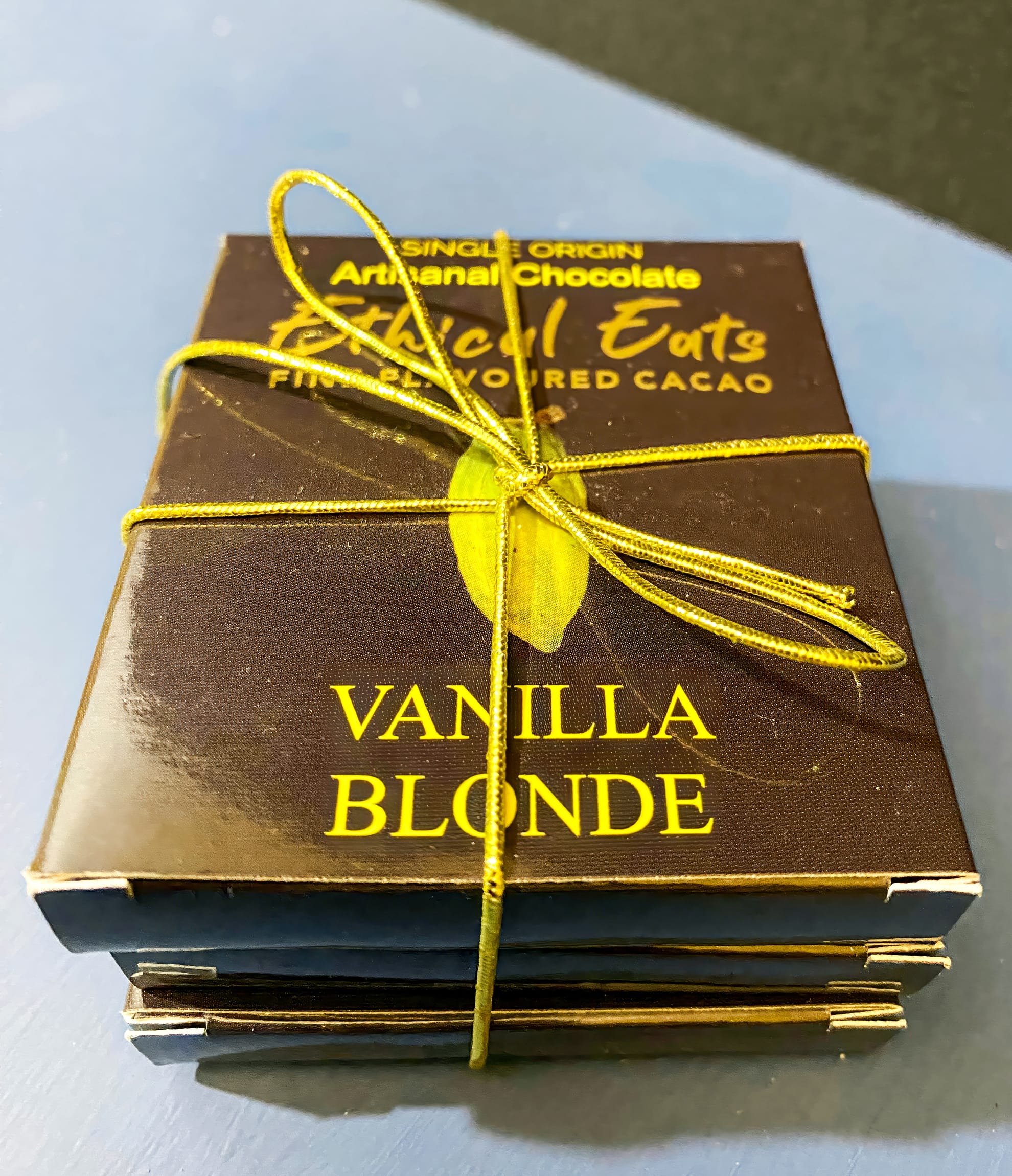 A stack of artisanal chocolate bars labelled 