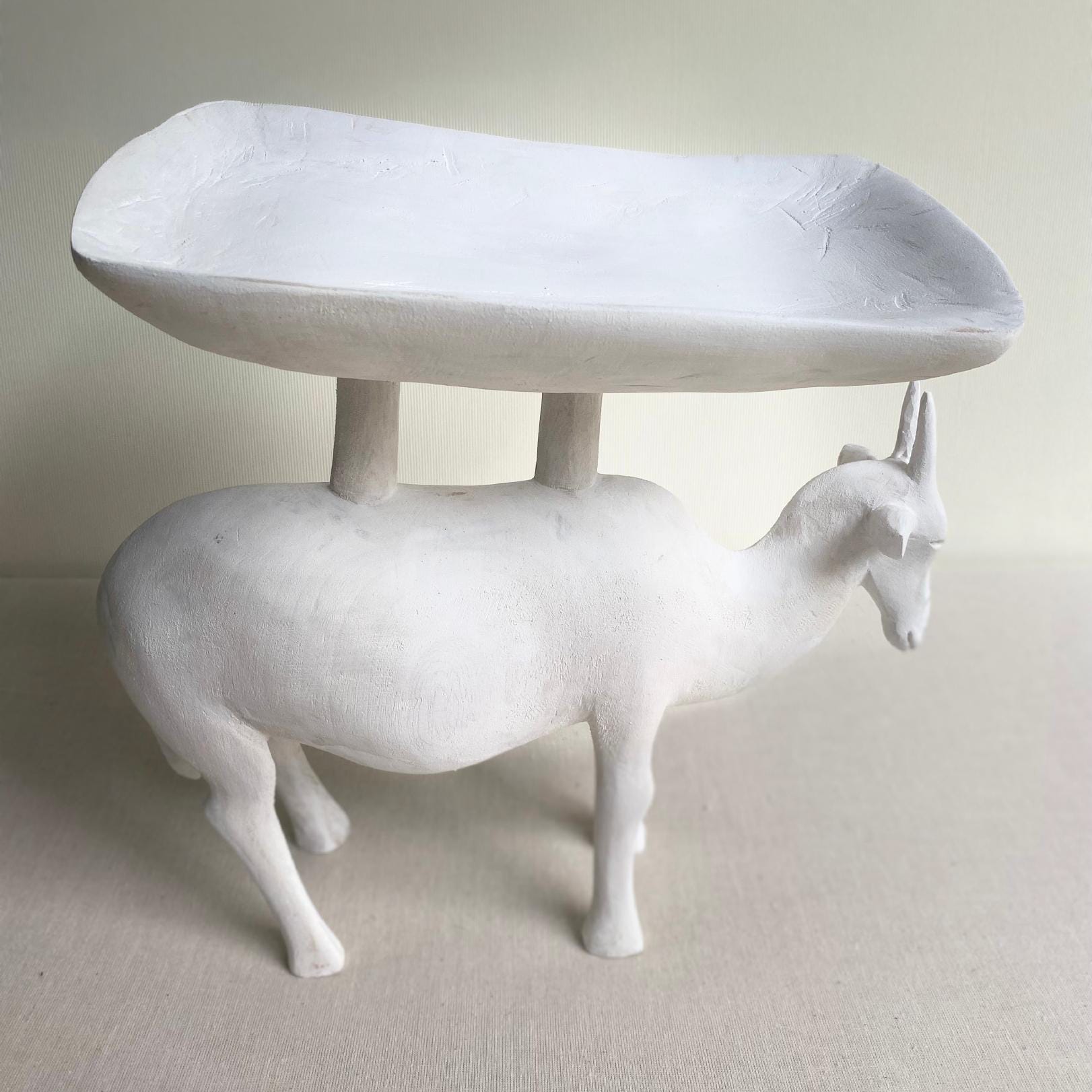 A white sculpture titled 