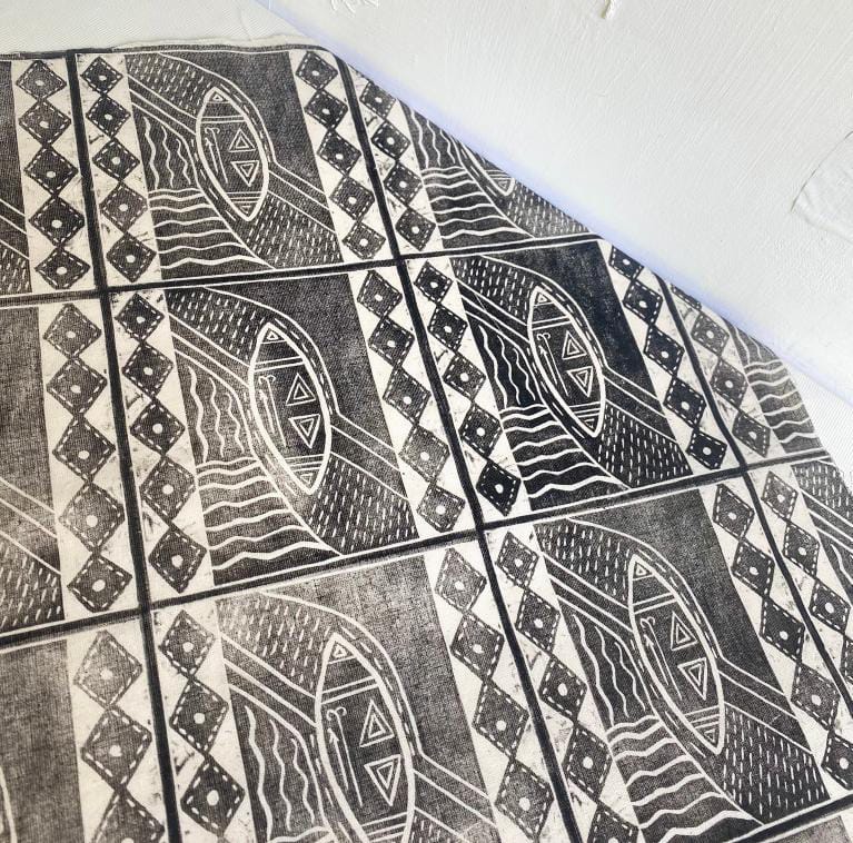 Black and white patterned tiles cover the floor and wall, their abstract geometric design echoing boats or shields amid waves—an atmosphere reminiscent of Contra.Joburg’s visual style and the quiet intrigue found in Weight of Silence.