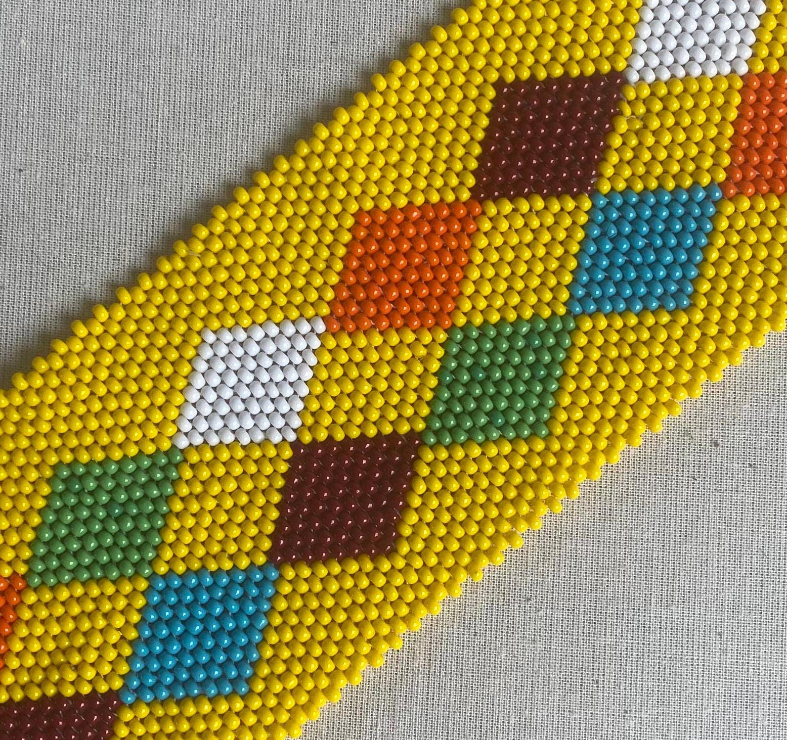 A bead bracelet with a diamond pattern, inspired by the Weight of Silence collection from Contra.Joburg.