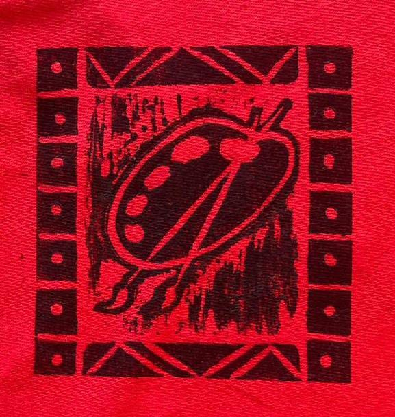 A black graphic of an artist’s palette with two paintbrushes is centred on a red background, reflecting Contra.Joburg’s hand-printed, textured style. The palette, framed by patterned borders, evokes the expressive spirit of Weight of Silence.