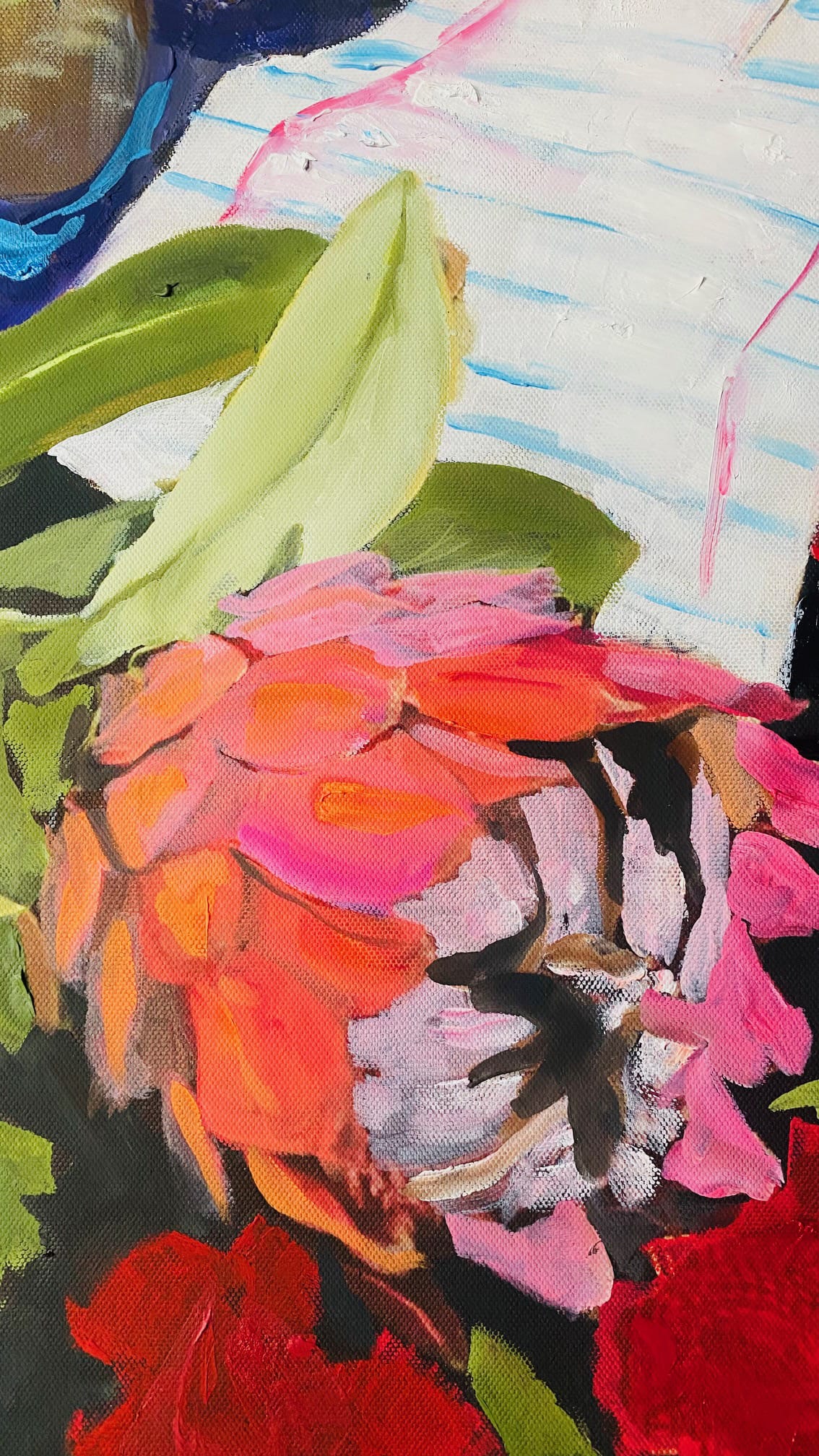 A close-up of a vibrant painting shows a pink and orange flower with green leaves against a background featuring blue-lined white paper. The brushstrokes are bold and textured, capturing the flower’s vivid colours and the paper’s subtle details.